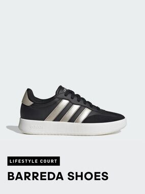 Adidas Women’s Black Sneakers with Silver Stripes